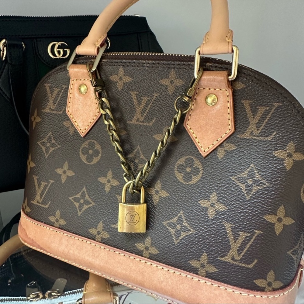 Vintage Louis Vuitton lock bag charm